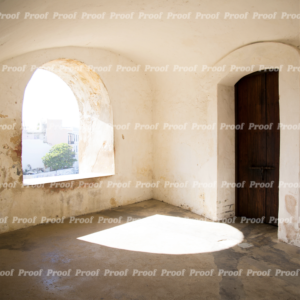 Sunlit archway and wooden door at Castillo San Felipe del Morro in San Juan, Puerto Rico, used as Anatomy of Release chapter art