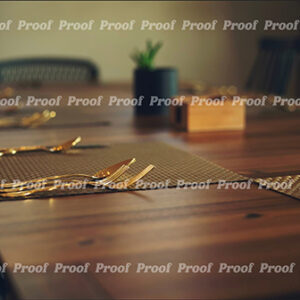 Wooden table set with placemats and gold flatware, used as Anatomy of Release chapter art