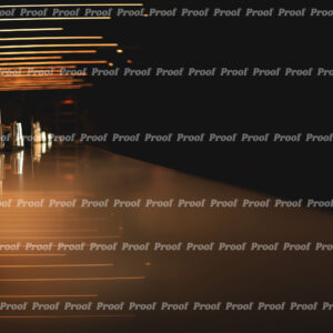 Moody photograph of an empty bar with amber lights and reflections, used as Anatomy of Release chapter art