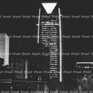 Black and white photograph of downtown Oklahoma City buildings lit at night, used as Anatomy of Release chapter art